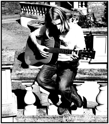 John playing guitar